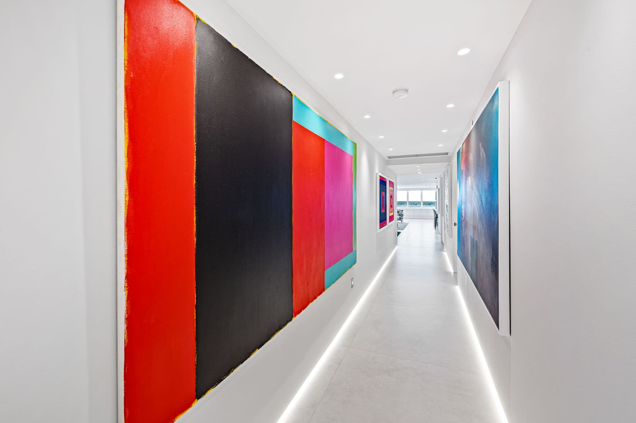 Art gallery corridor with color field paintings